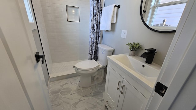 bathroom with toilet, vanity, and a shower with curtain