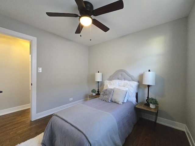 bedroom with ceiling fan and dark wood-type flooring