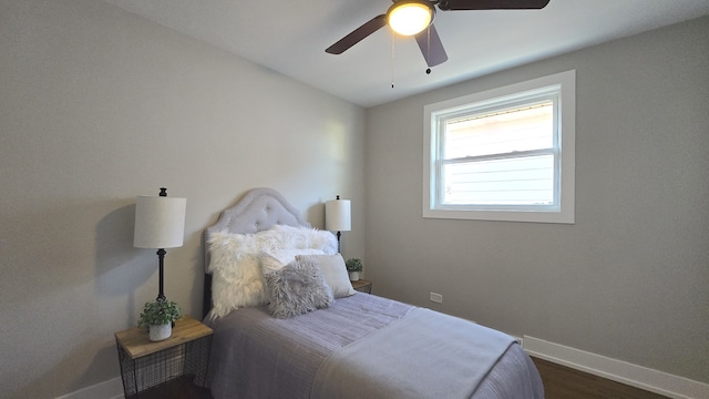 bedroom featuring ceiling fan and dark hardwood / wood-style flooring