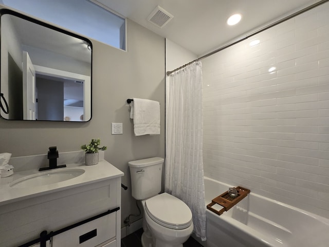 full bathroom featuring toilet, vanity, and shower / bath combo