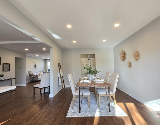 dining room with dark hardwood / wood-style floors