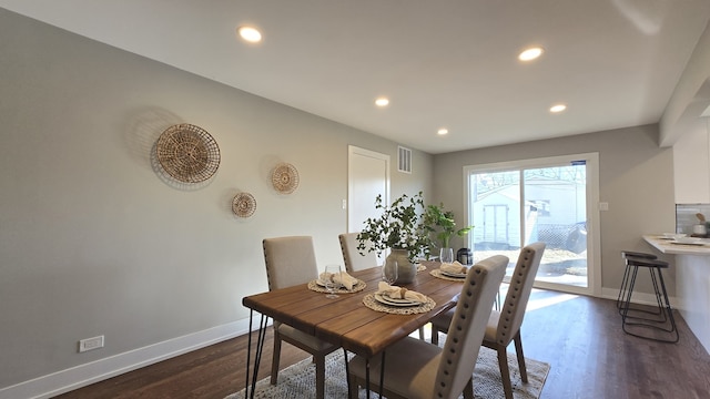 dining room featuring dark hardwood / wood-style flooring