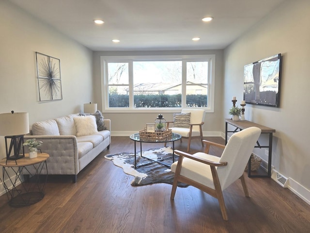 living room with dark hardwood / wood-style flooring