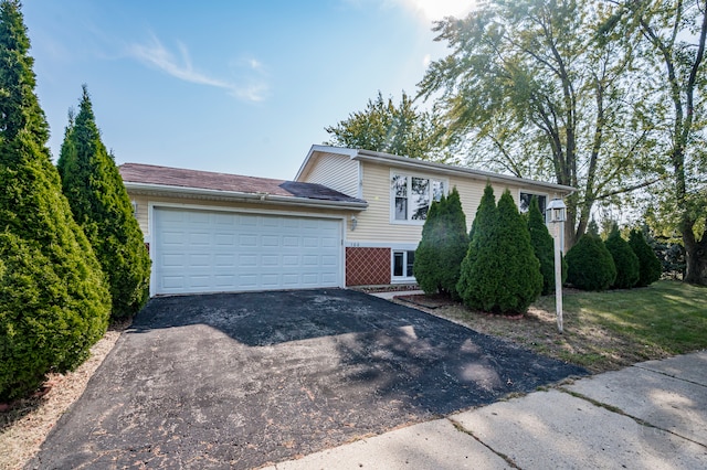 split level home featuring a garage