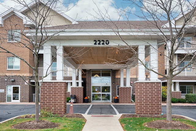 entrance to property with a balcony