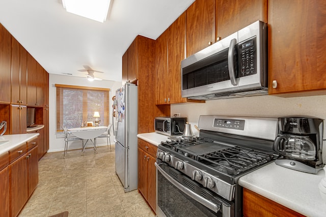 kitchen featuring ceiling fan and stainless steel appliances