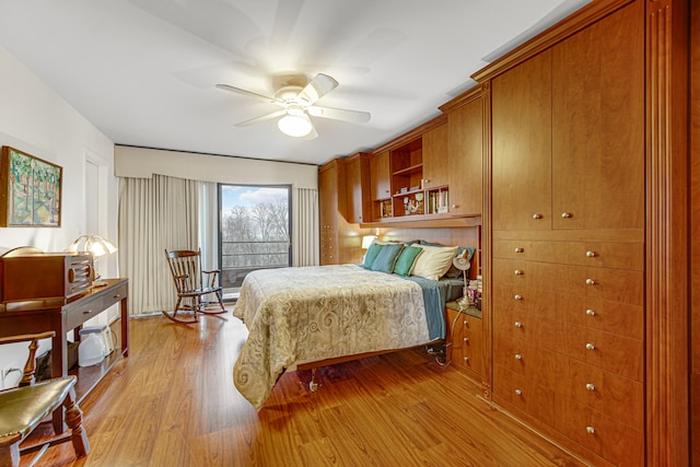 bedroom with ceiling fan and light hardwood / wood-style flooring