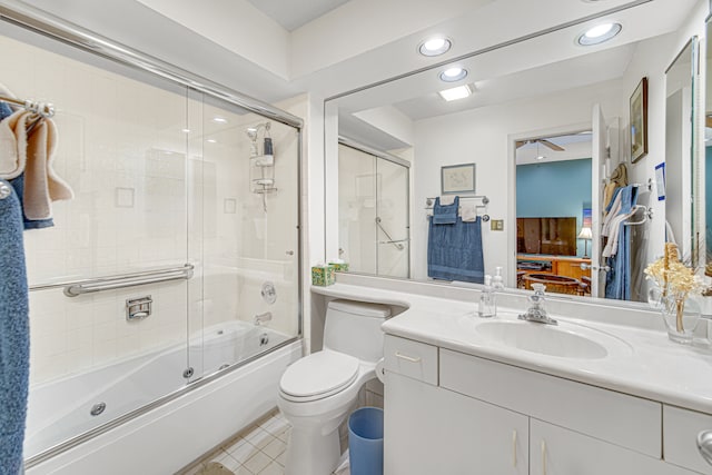 full bathroom with vanity, toilet, and enclosed tub / shower combo