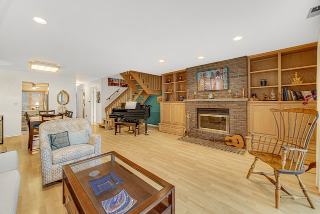 living room featuring a fireplace and hardwood / wood-style floors