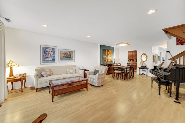 living room with light hardwood / wood-style floors