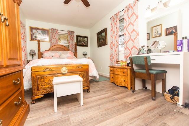 bedroom with ceiling fan and light wood-type flooring