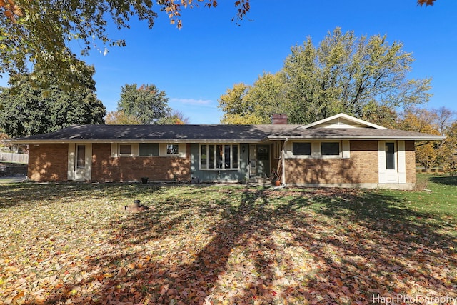 ranch-style house with a front yard