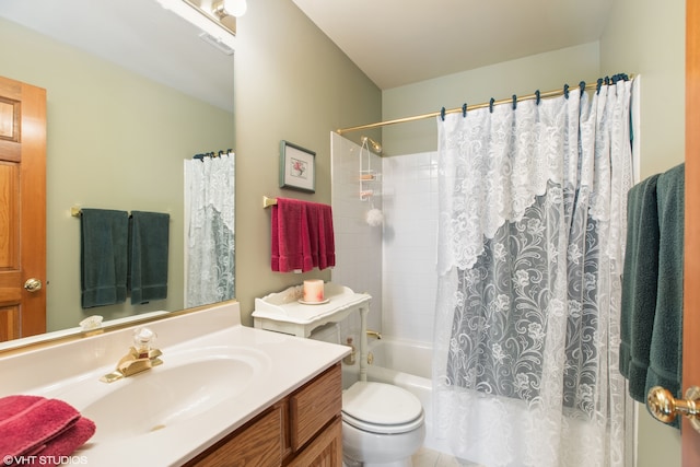 full bathroom featuring toilet, tile patterned flooring, vanity, and shower / tub combo