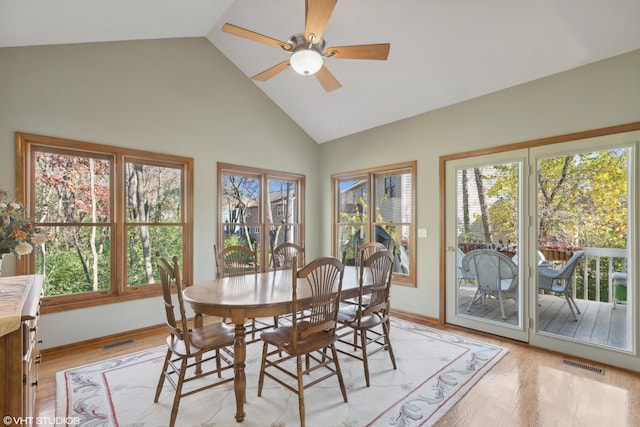 dining space with a wealth of natural light, light wood-type flooring, and ceiling fan