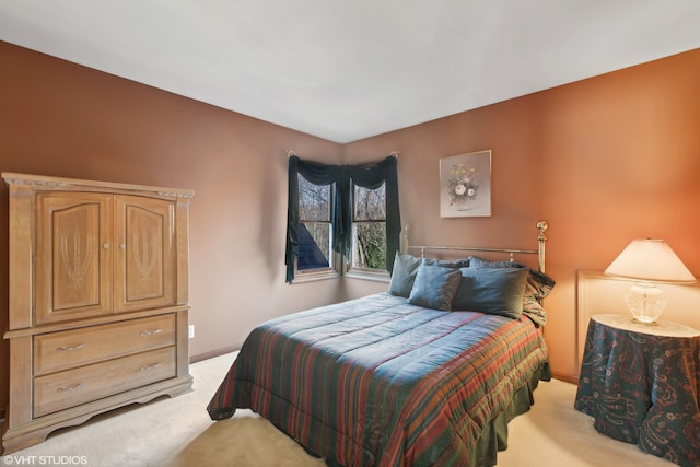 bedroom with light colored carpet