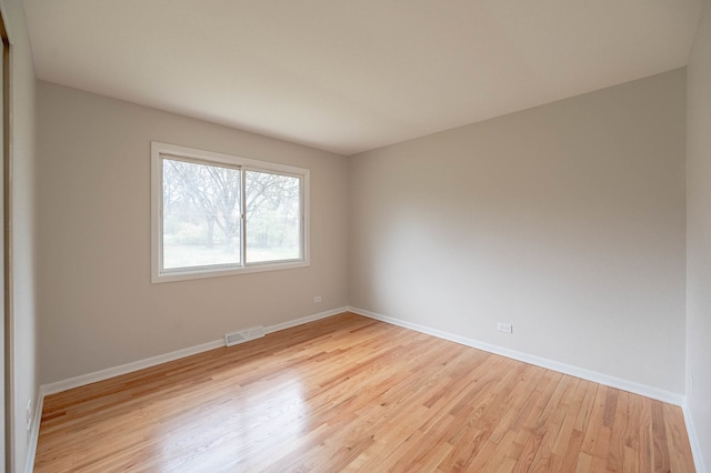 unfurnished room with light hardwood / wood-style floors