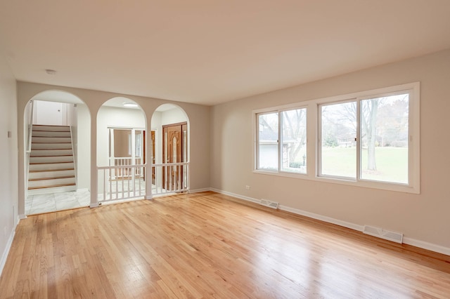 spare room with light hardwood / wood-style flooring