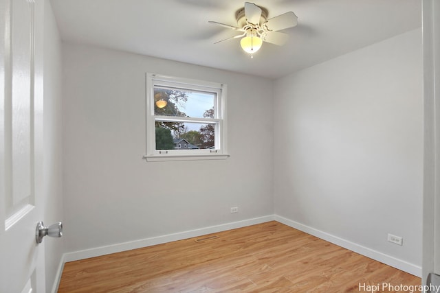 spare room with ceiling fan and light hardwood / wood-style flooring