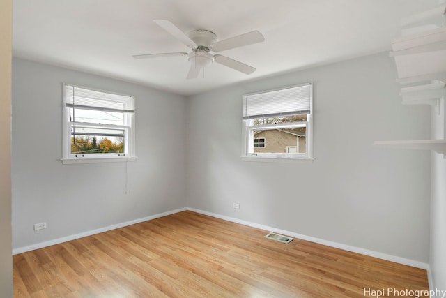 unfurnished room featuring ceiling fan and light hardwood / wood-style floors