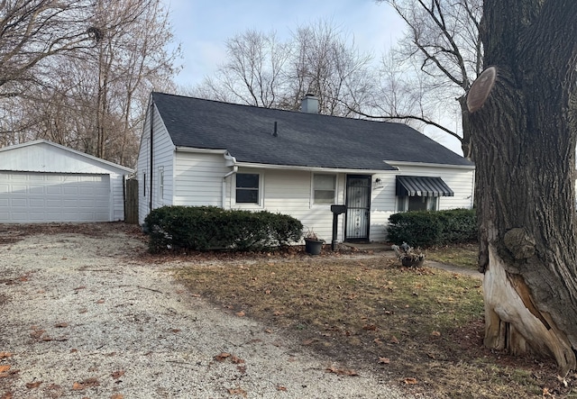 view of front of home featuring an outdoor structure and a garage