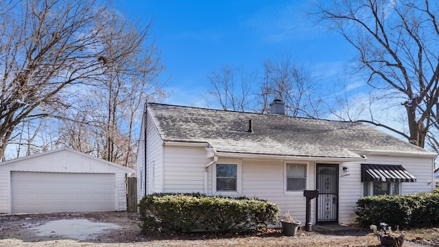 view of front facade featuring an outbuilding and a garage