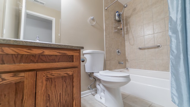 full bathroom with vanity, tile patterned floors, shower / tub combo, and toilet