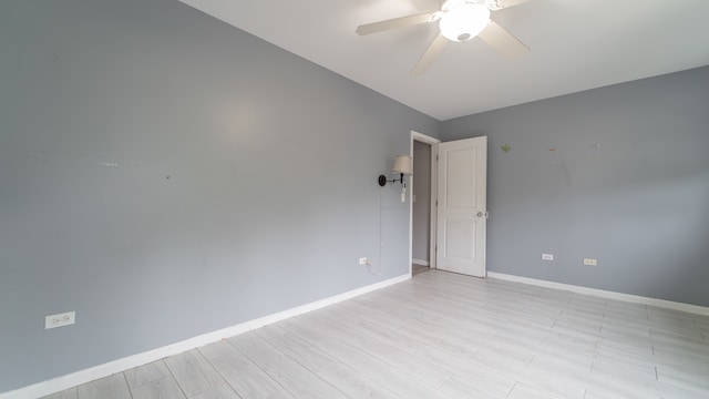 unfurnished room with ceiling fan and light hardwood / wood-style floors