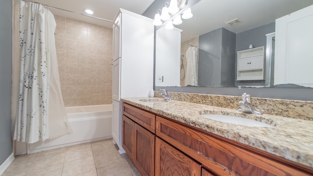 bathroom with vanity, shower / bath combo with shower curtain, and tile patterned flooring