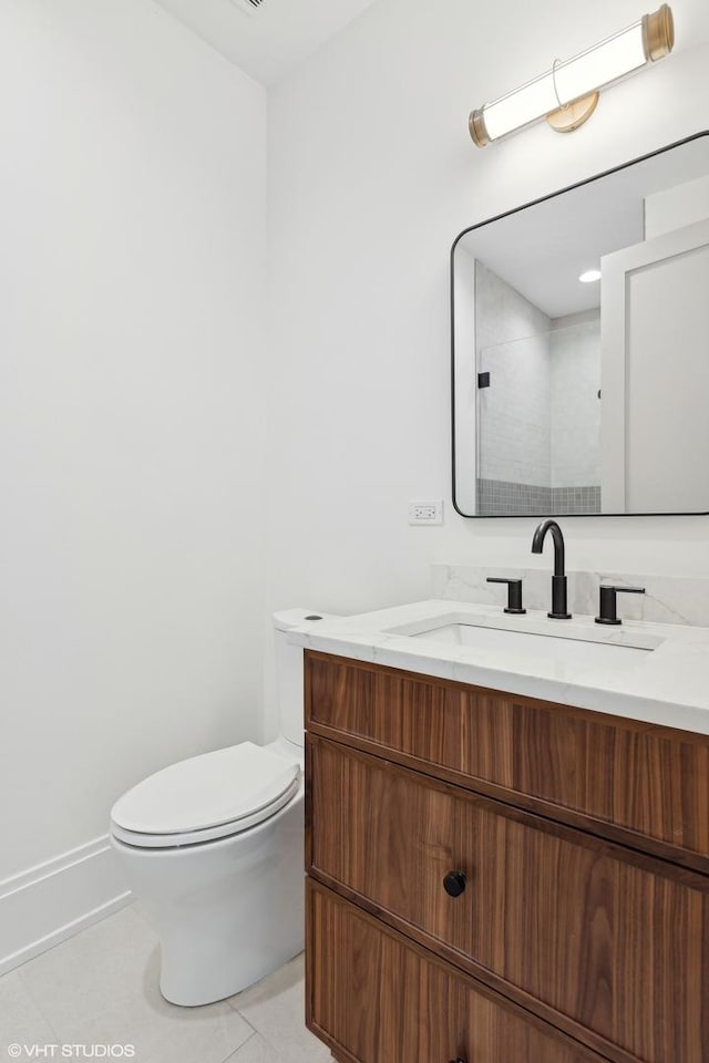 bathroom with tile patterned floors, toilet, a shower with shower door, and vanity