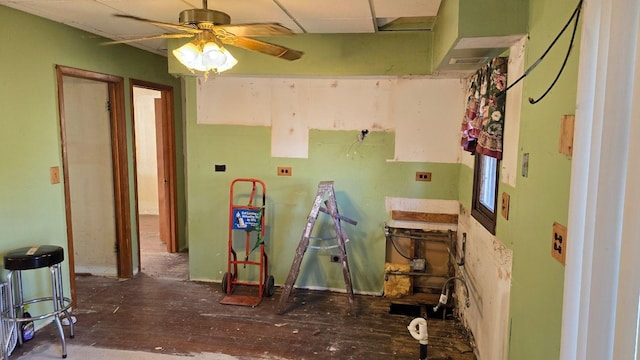 misc room with ceiling fan and a paneled ceiling