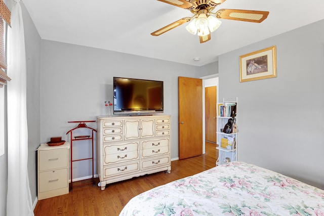 bedroom featuring ceiling fan and wood-type flooring