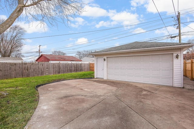 garage featuring a lawn