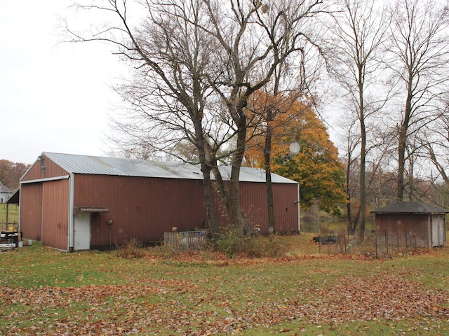 view of home's exterior featuring an outbuilding