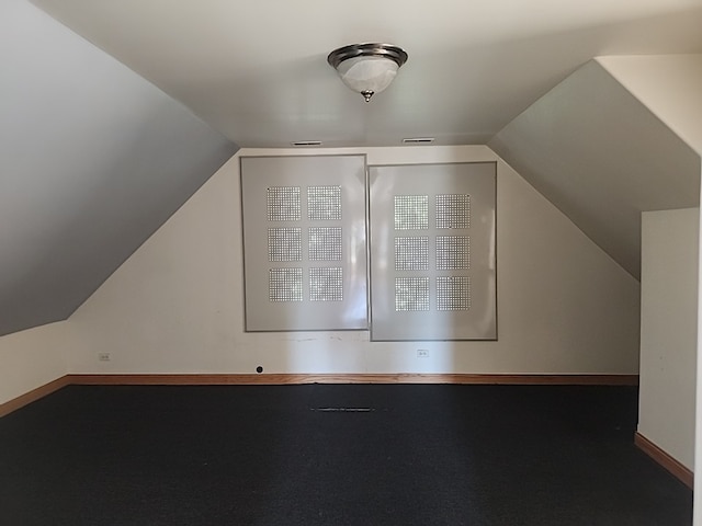 additional living space with vaulted ceiling