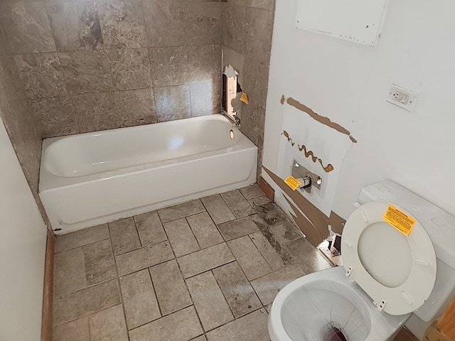 bathroom featuring a bathtub and toilet