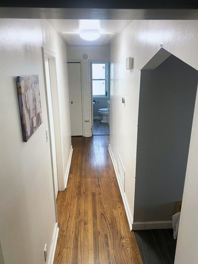 hall with dark wood-type flooring