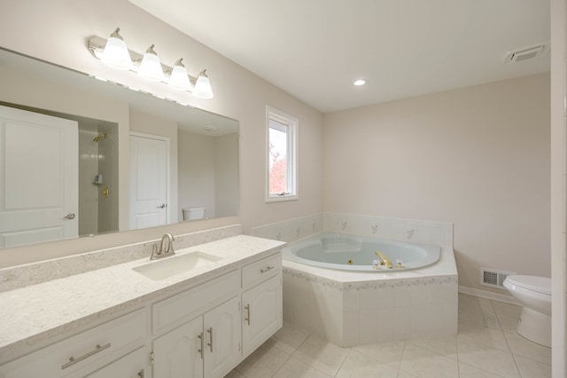 full bathroom featuring vanity, toilet, independent shower and bath, and tile patterned floors