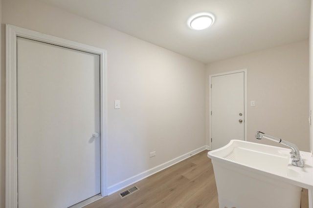 bathroom featuring hardwood / wood-style floors and sink