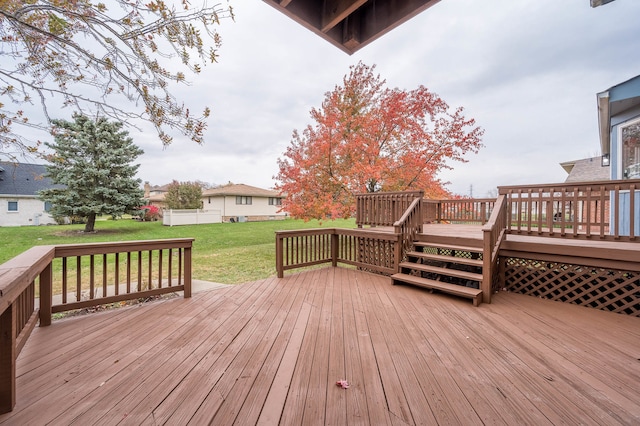 wooden deck with a yard