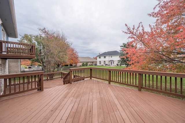 wooden deck with a yard