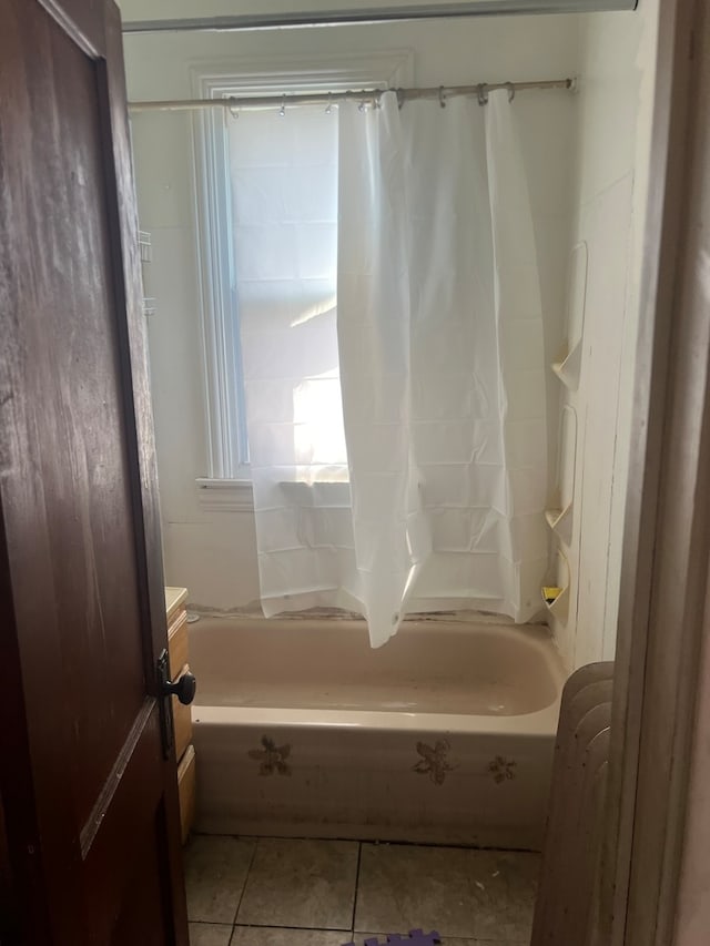 bathroom featuring vanity, tile patterned floors, and shower / bath combo