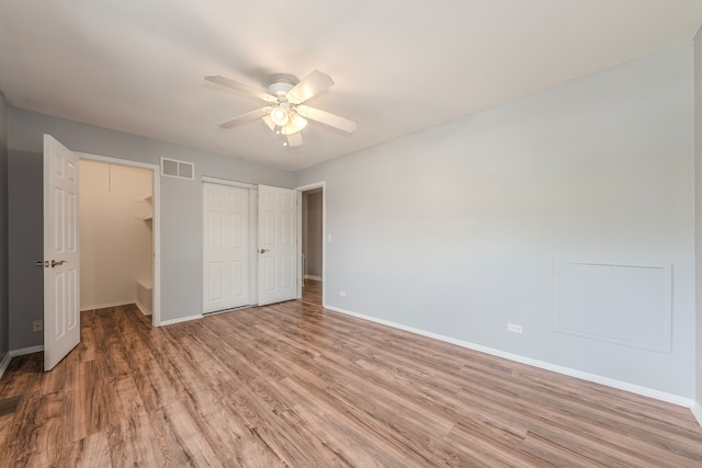 unfurnished bedroom featuring light hardwood / wood-style flooring and ceiling fan