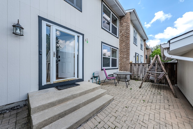 doorway to property with a patio