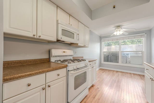 kitchen with white appliances, light wood-type flooring, ceiling fan, white cabinets, and ornamental molding