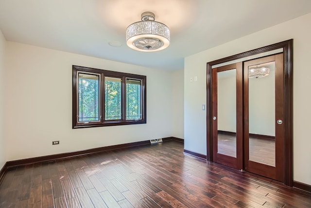 spare room featuring dark hardwood / wood-style floors