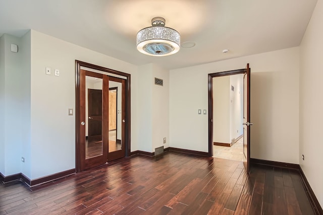 spare room featuring dark hardwood / wood-style floors