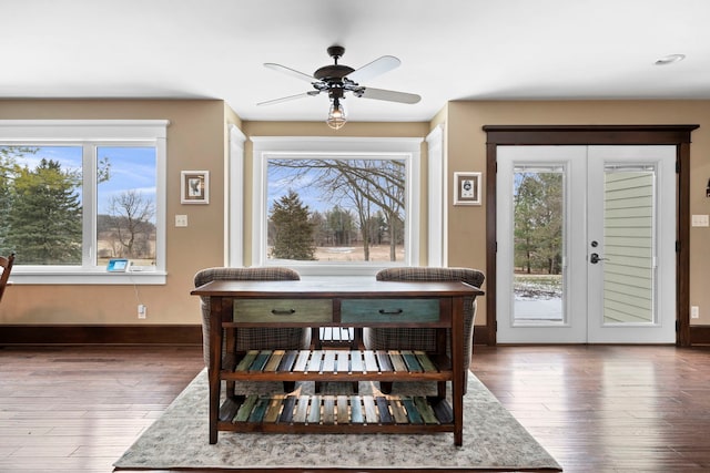 dining area with dark wood-type flooring, ceiling fan, and french doors