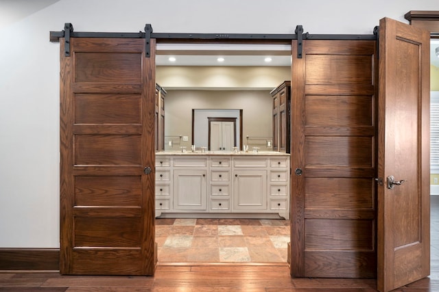 bathroom with hardwood / wood-style flooring and vanity