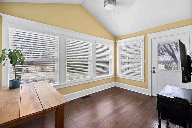 interior space with ceiling fan, dark wood-type flooring, and vaulted ceiling