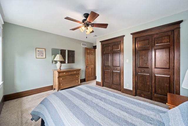 carpeted bedroom with a closet and ceiling fan